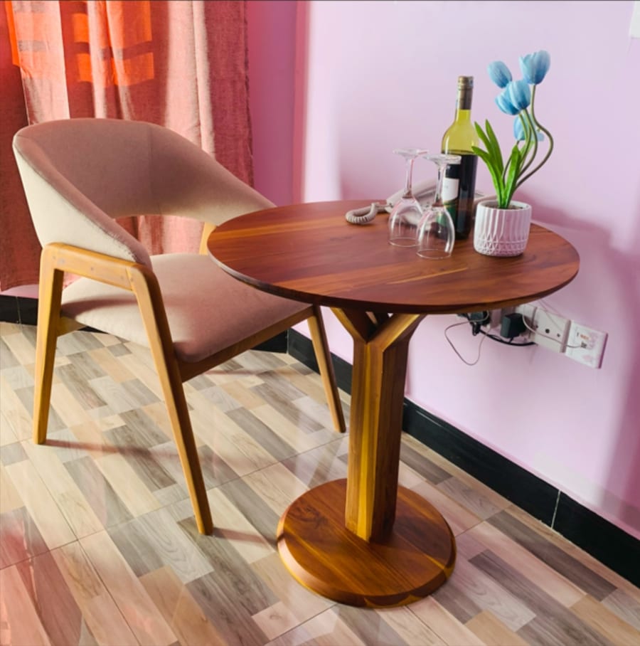 In-room seating area with round wooden table